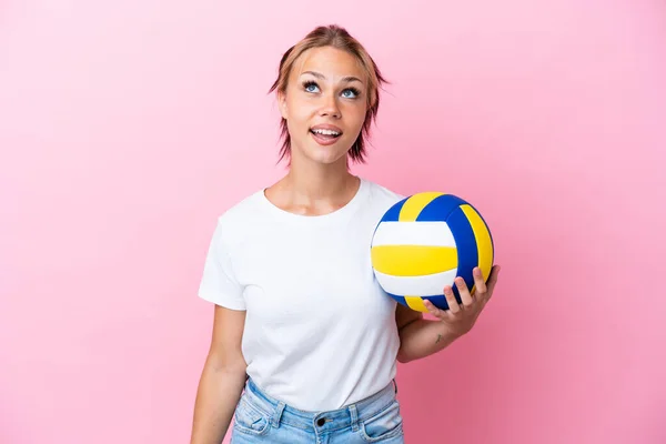 Young Russian Woman Playing Volleyball Isolated Pink Background Looking Surprised — 图库照片
