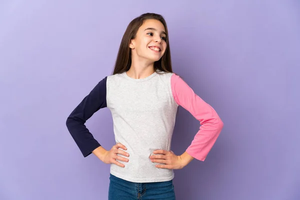 Little Girl Isolated Purple Background Posing Arms Hip Smiling — Stock Photo, Image