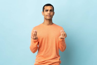 African American man over isolated background making money gesture but is ruined