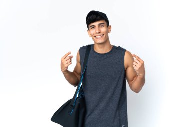Young sport Argentinian man with sport giving a thumbs up gesture