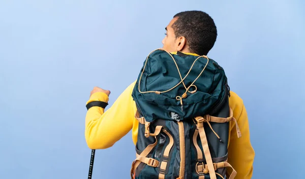 African American Man Backpack Trekking Poles Isolated Background Back Position — 图库照片