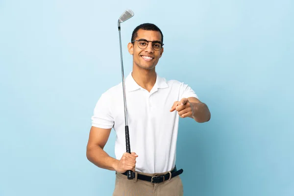 African American Man Isolated Blue Background Playing Golf Pointing Front — стоковое фото
