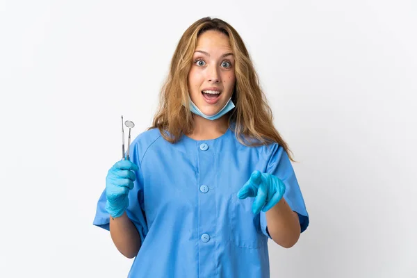Woman Dentist Holding Tools Isolated White Background Surprised Pointing Front — Stock fotografie