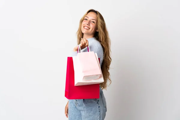 Mujer Rubia Joven Aislada Sobre Fondo Blanco Sosteniendo Bolsas Compras — Foto de Stock