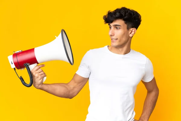 Young Argentinian Man Isolated Yellow Background Holding Megaphone Stressed Expression — Φωτογραφία Αρχείου