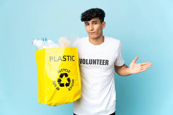 Young Argentinian Man Holding Bag Full Plastic Having Doubts While — 스톡 사진