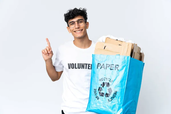 Young Man Holding Recycling Bag Full Paper Showing Lifting Finger — Foto de Stock
