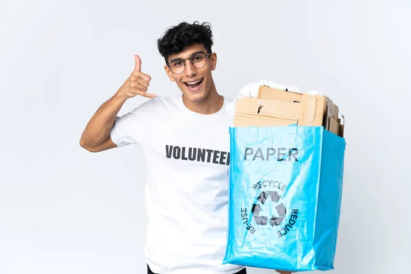 Young Man Holding Recycling Bag Full Paper Making Phone Gesture — Foto de Stock