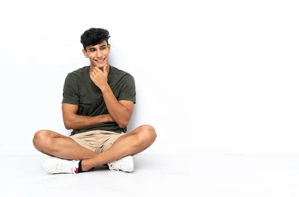 Young Argentinian Man Sitting Floor Looking Side — 스톡 사진