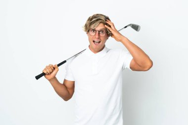 English man playing golf with surprise expression
