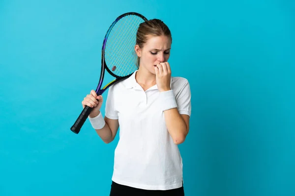 Joven Jugadora Tenis Aislada Sobre Fondo Azul Teniendo Dudas —  Fotos de Stock