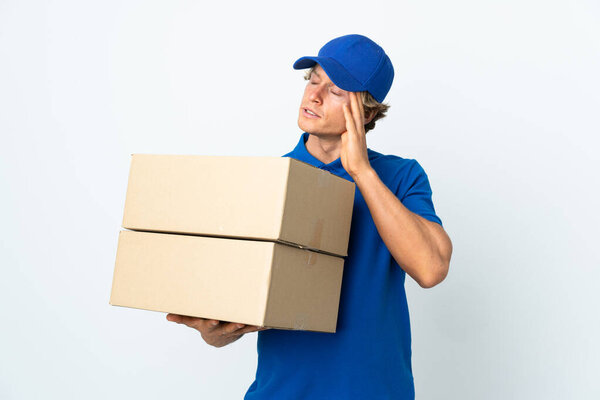 Delivery man over isolated white background with headache