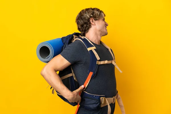 Young Mountaineer Man Isolated Yellow Background Suffering Backache Having Made — Φωτογραφία Αρχείου