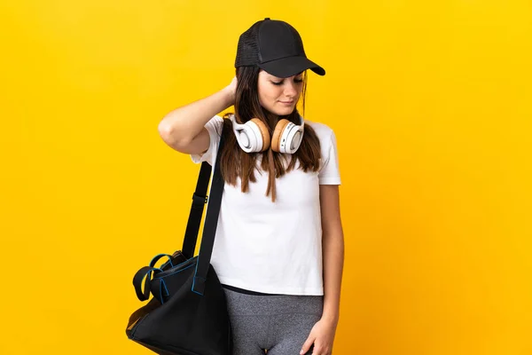 Young Sport Woman Sport Bag Isolated Yellow Background Neckache — Φωτογραφία Αρχείου