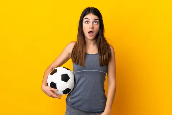 Young Football Player Woman Isolated Yellow Background Looking Surprised Expression — Zdjęcie stockowe