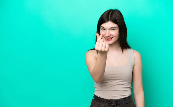 Young Russian Woman Isolated Green Background Making Money Gesture — Foto de Stock