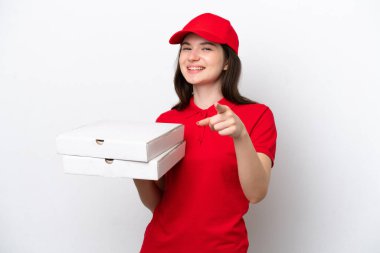 Young Russian pizza delivery picking up pizza boxes isolated on white background pointing front with happy expression