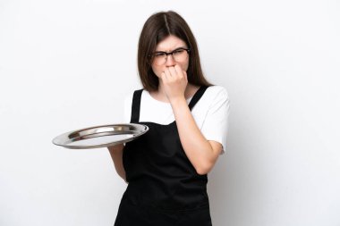 Young Russian woman chef with tray isolated on white background having doubts