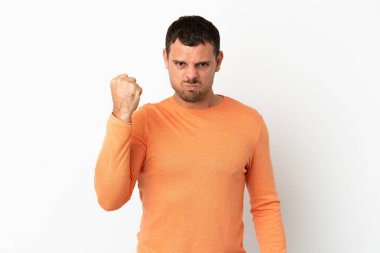Brazilian man over isolated white background with unhappy expression