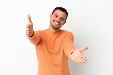 Brazilian man over isolated white background presenting and inviting to come with hand
