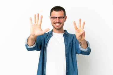 Brazilian man over isolated white background counting eight with fingers