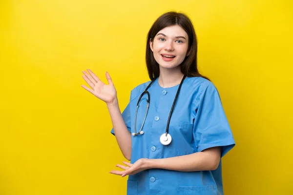 Young Surgeon Doctor Russian Woman Isolated Yellow Background Extending Hands — стокове фото