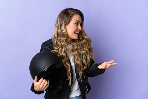 Young Brazilian Woman Holding Motorcycle Helmet Isolated Purple Background Surprise — стоковое фото