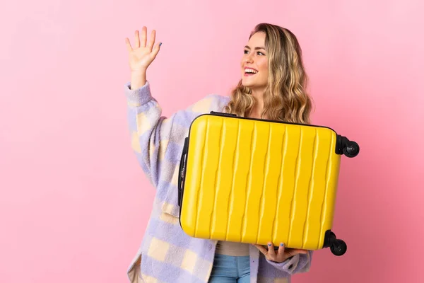 Young Brazilian Woman Isolated Pink Background Vacation Travel Suitcase Saluting — Stockfoto