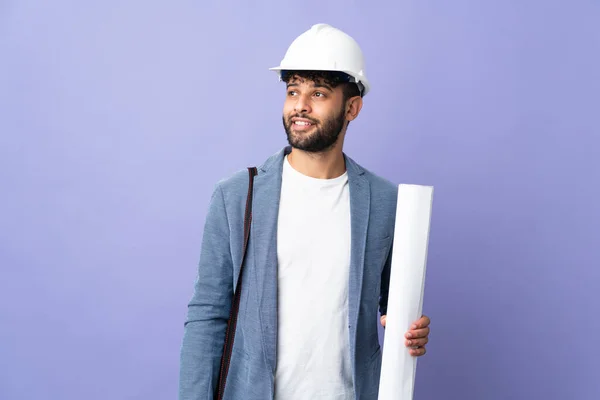 Young Architect Moroccan Man Helmet Holding Blueprints Isolated Background Thinking — Fotografia de Stock