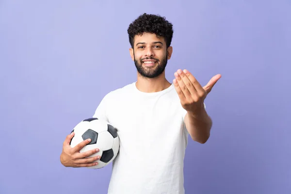 Young Moroccan Man Isolated Purple Background Soccer Ball Doing Coming — Stock Photo, Image