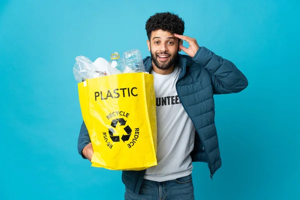 Young Moroccan Man Holding Bag Full Plastic Bottles Recycle Isolated — стокове фото