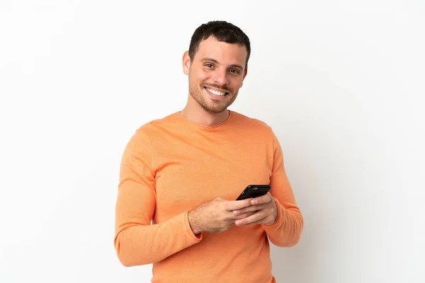 Brazilian Man Isolated White Background Sending Message Mobile — Zdjęcie stockowe