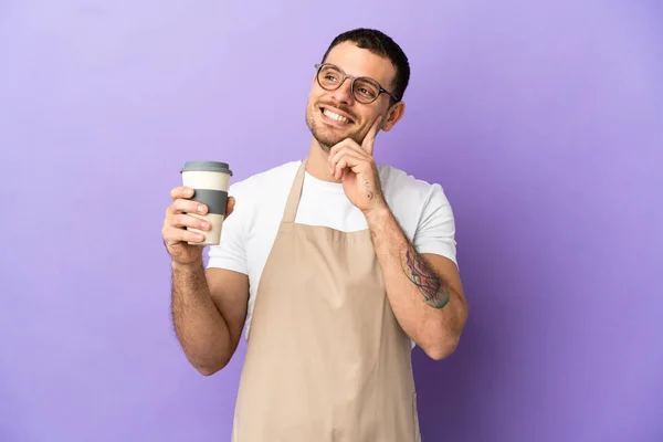 Brazilian Restaurant Waiter Isolated Purple Background Thinking Idea While Looking — стокове фото