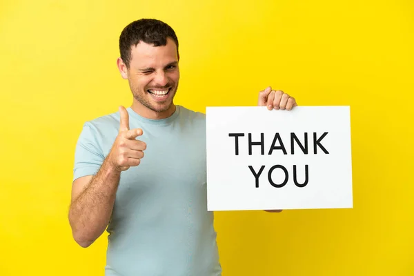 Brazilian Man Isolated Purple Background Holding Placard Text Thank You — Fotografia de Stock