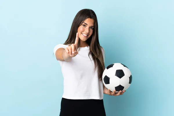 Young Football Player Brazilian Girl Isolated Blue Background Showing Lifting — Stok fotoğraf