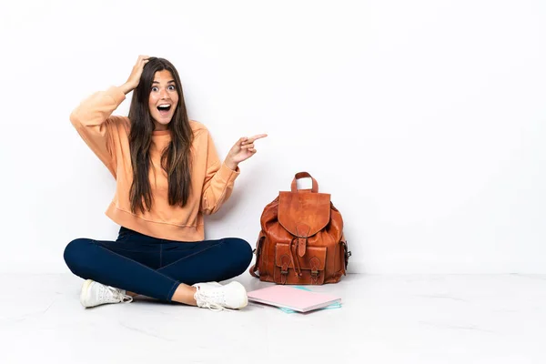 Young Student Brazilian Woman Sitting Floor Surprised Pointing Finger Side — Stockfoto