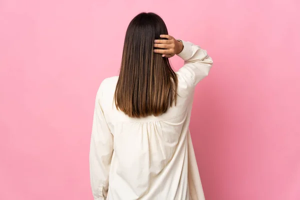 Teenager Girl Isolated Pink Background Back Position Thinking — Stockfoto