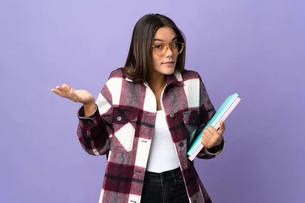 Young Student Woman Isolated Purple Background Having Doubts While Raising — Fotografia de Stock