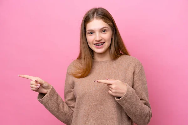 Teenager Russian Girl Isolated Pink Background Surprised Pointing Side — 图库照片