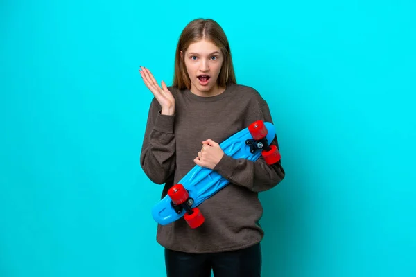 Teenager Russian Girl Isolated Blue Background Skate Doing Surprise Gesture — Stock Photo, Image