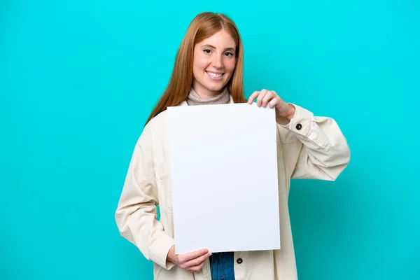 Young Redhead Woman Isolated Blue Background Holding Empty Placard Happy — Stock Photo, Image