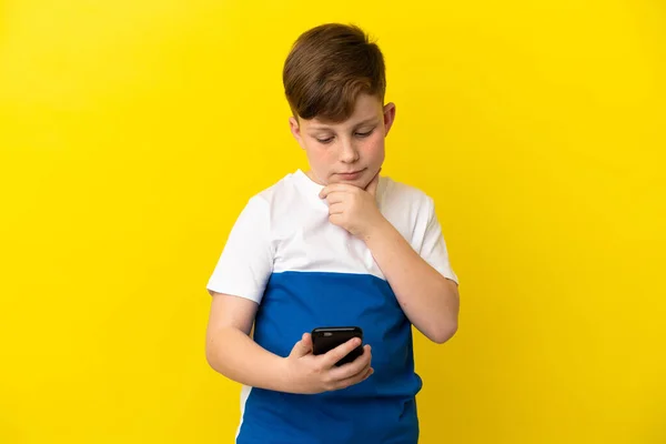 Little Redhead Boy Isolated Yellow Background Thinking Sending Message — Stock Photo, Image