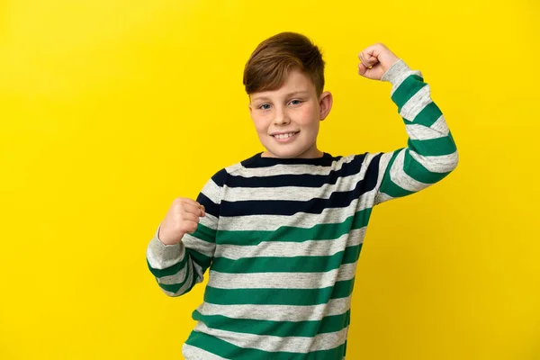 Little Redhead Boy Isolated Yellow Background Celebrating Victory — Stock Photo, Image