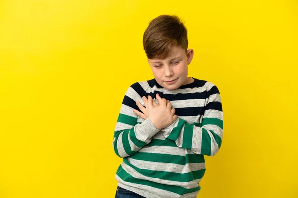 Little Redhead Boy Isolated Yellow Background Having Pain Heart — Stock Photo, Image