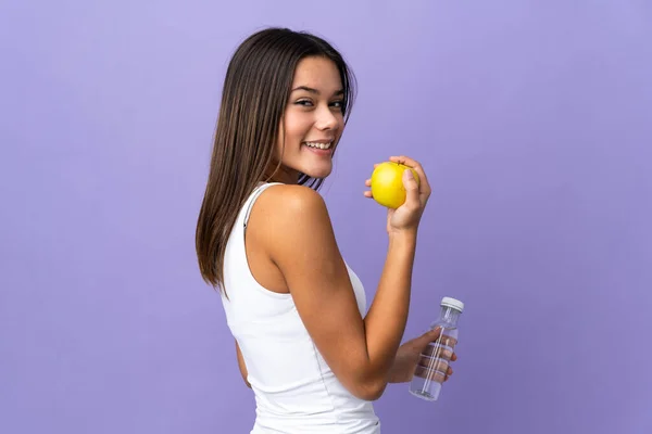 Adolescente Menina Isolada Fundo Roxo Com Uma Maçã Com Uma — Fotografia de Stock