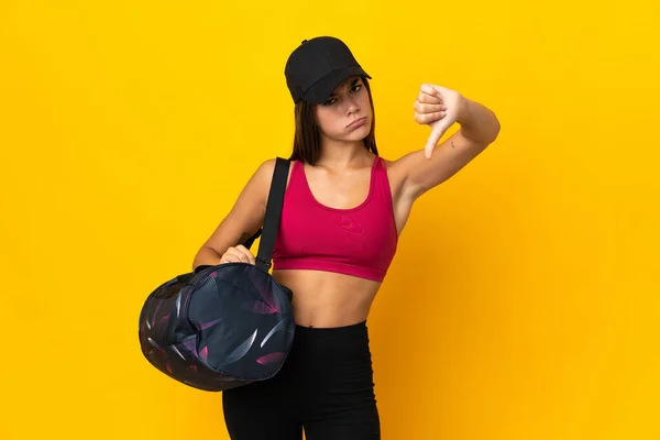 Teenager Sport Girl Sport Bag Showing Thumb Negative Expression — Φωτογραφία Αρχείου