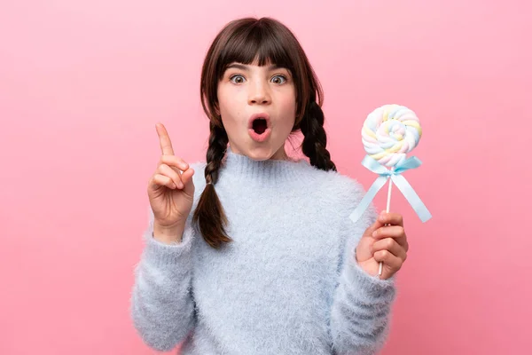 Little Caucasian Girl Holding Lollipop Intending Realizes Solution While Lifting — Stock Photo, Image