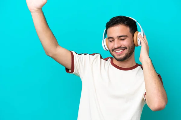 Young Brazilian Man Isolated Blue Background Listening Music Dancing — Stock Photo, Image