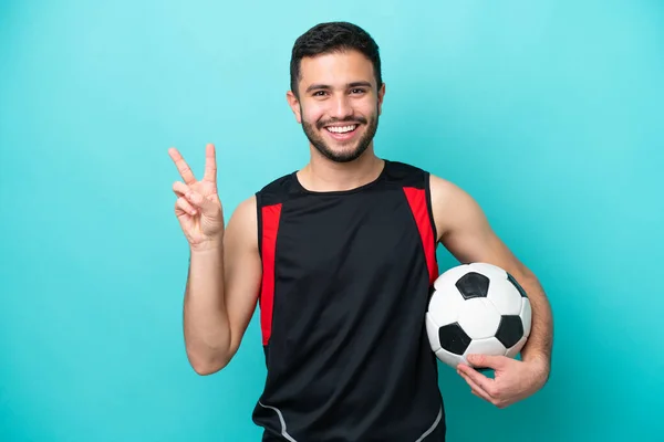 Giovane Giocatore Calcio Brasiliano Isolato Sfondo Blu Sorridente Mostrando Segno — Foto Stock