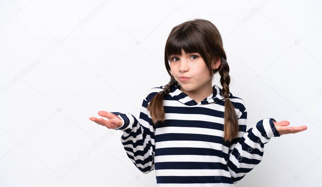 Little caucasian girl isolated on white background having doubts while raising hands